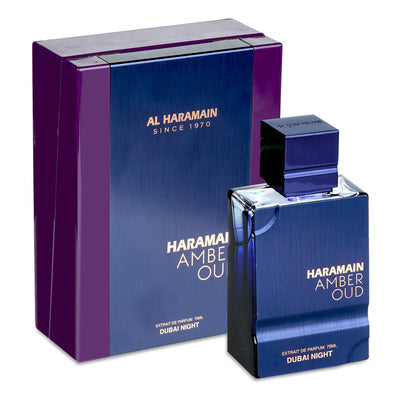 A bottle of Al Haramain Amber Oud Dubai Night perfume with its purple and blue packaging, indicating it is an unisex fragrance.
