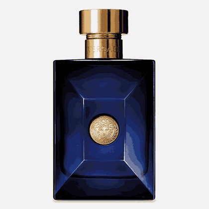 A bottle of Versace Dylan Blue Eau De Toilette for Men with a clear blue liquid visible inside. The bottle features a gold-colored cap and Versace's iconic Medusa emblem on the front.